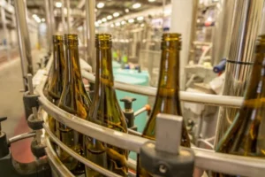 Brewing and bottling process with activated carbon